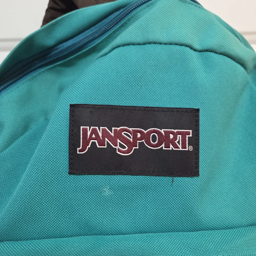 JanSport Turquoise and Brown Unisex Backpack.